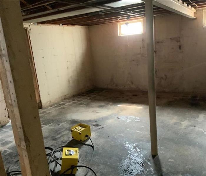 image of residential basement unfinished looking dirty and damaged